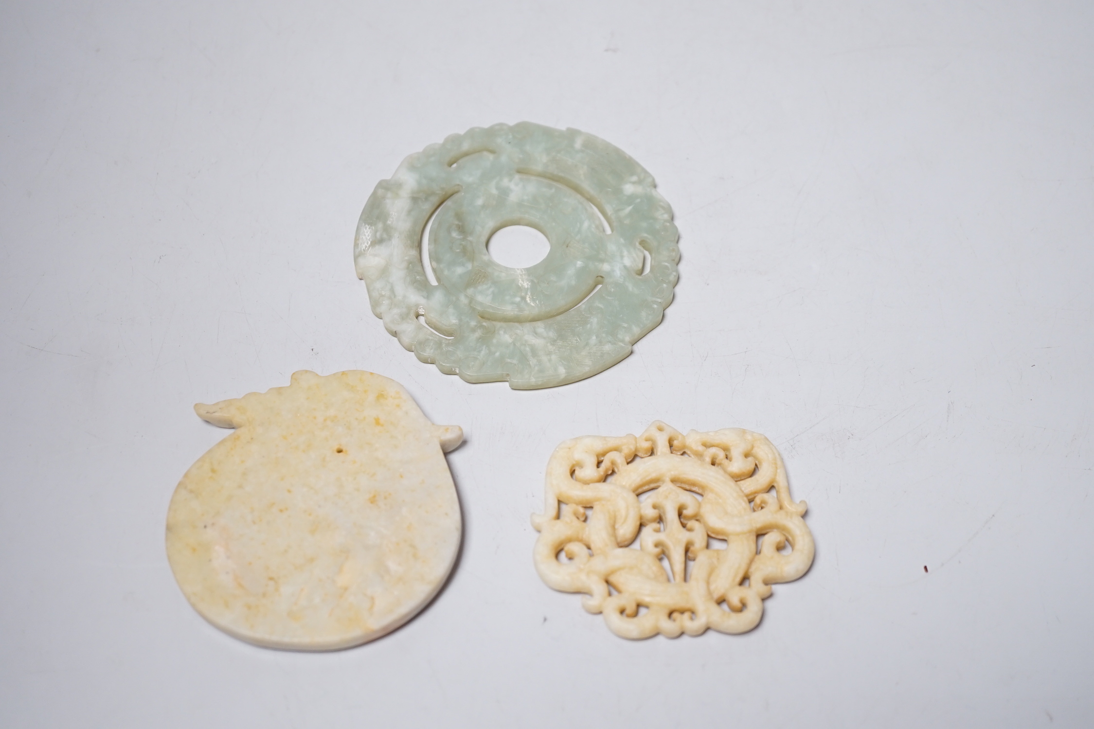 A Chinese bi disc and two other hardstone carvings